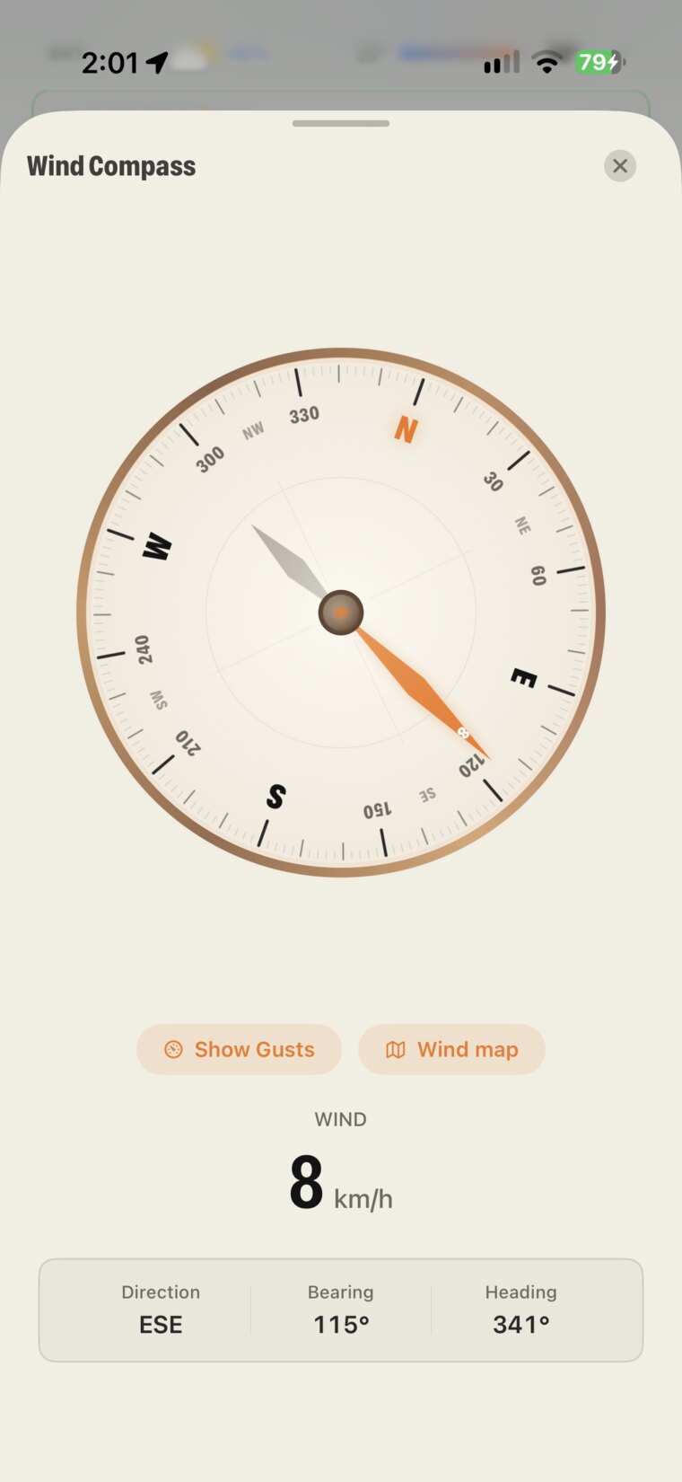 Wind Compass full-screen view: the needle points east-southeast at 8 km/h, with Show Gusts, Wind map, and direction, bearing and heading readouts
